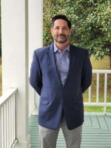 Man in a blazer and blue button up
